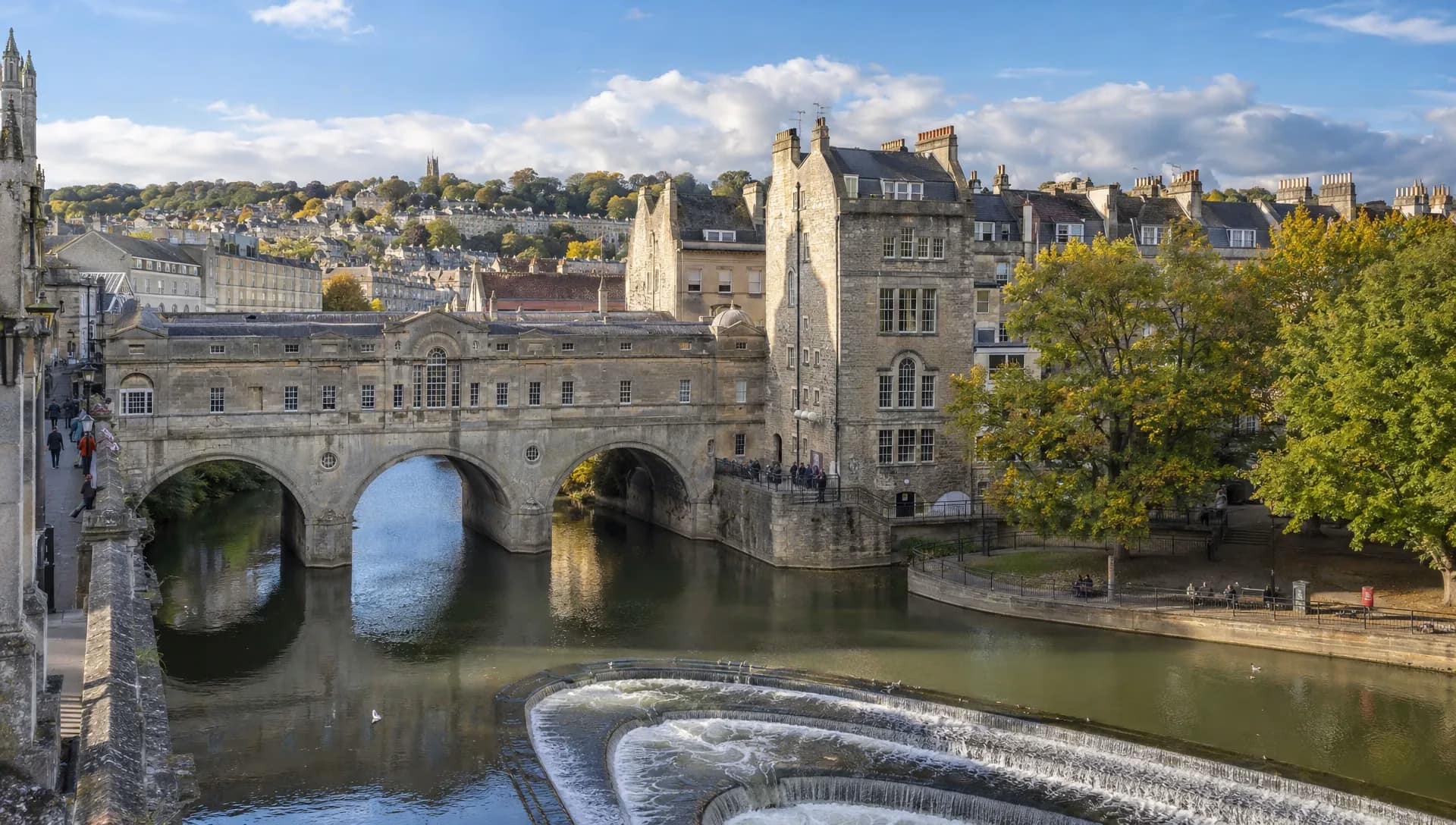 Pulteney Bridge crosses the River Avon beneath Bath’s Georgian buildings on a day trip from London.