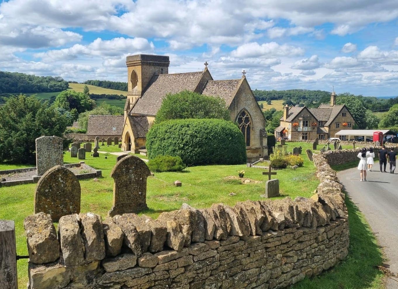 Snowshill church and stone cottages viewed down the hillside