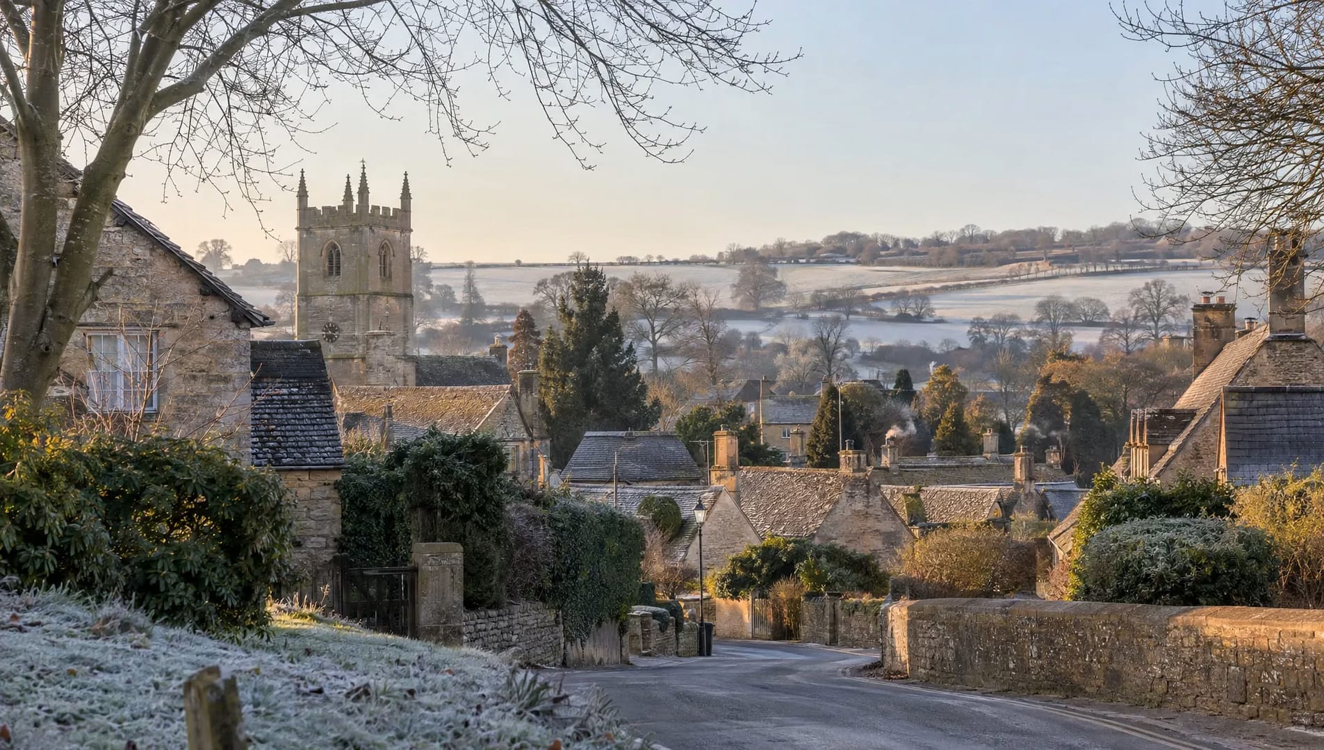 stone-cottages-and-a-church-tower-overlook-winter-1792882374477 Stone cottages and a church tower overlook winter fields in a quiet Cotswolds village visited on Christmas Day.